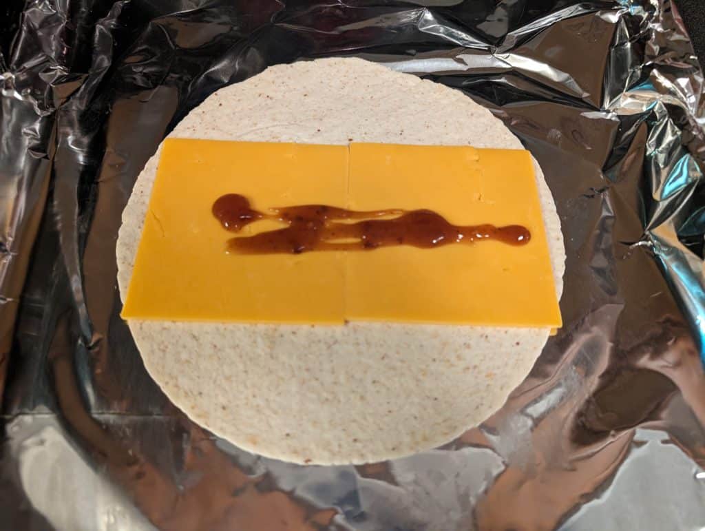 Low carb wrap with cheddar cheese and BBQ sauce