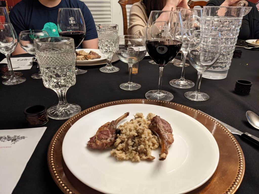 Two Lamb Lollipops plated with Cauliflower Rice Risotto