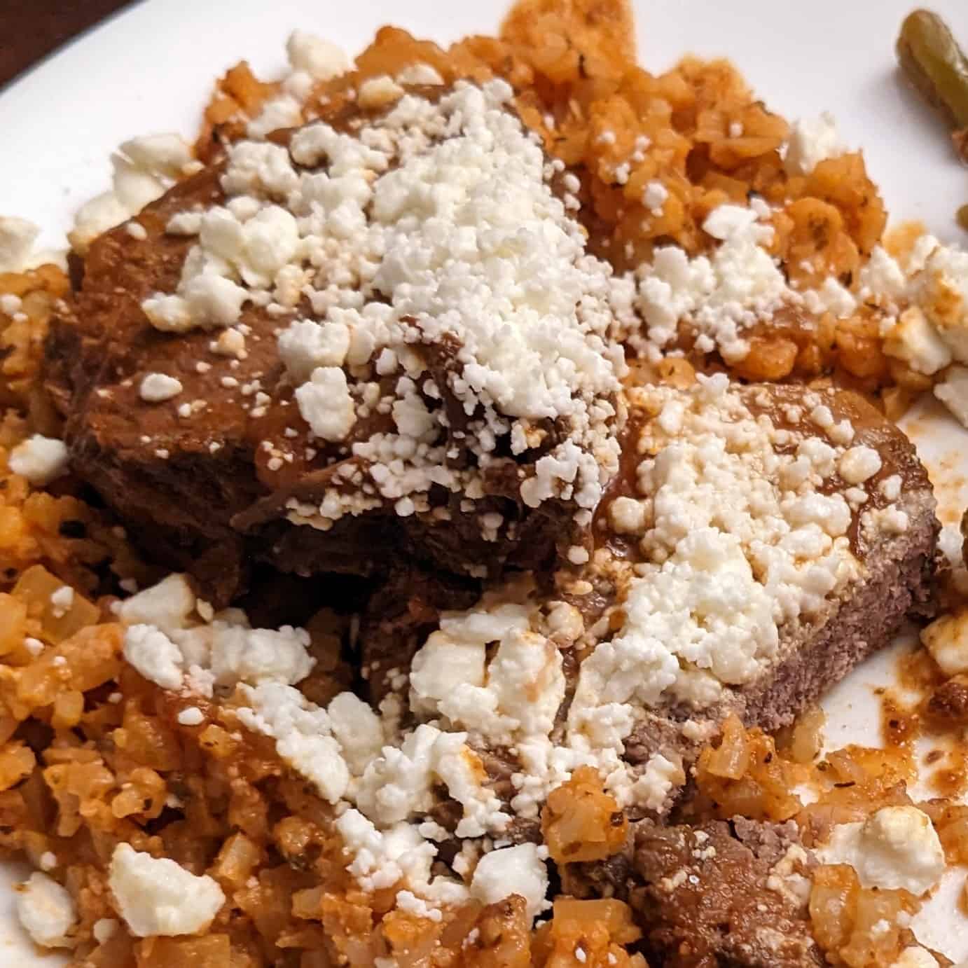 Mediterranean Beef Roast and Mediterranean Cauliflower Rice on plate with Feta