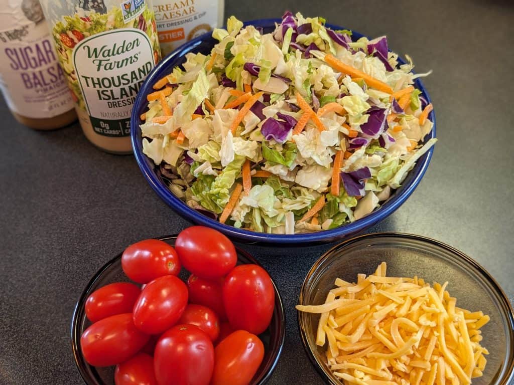 Tossed Salad with cheese, grape tomatoes, and salad dressings