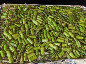 Broccoli and Asparagus Louie Salad - Chopped Asparagus on Wire Rack in Rimmed Baking Sheet