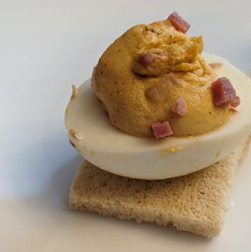 Ham, Chipotle, and Cheddar Deviled Egg on a piece of keto toast