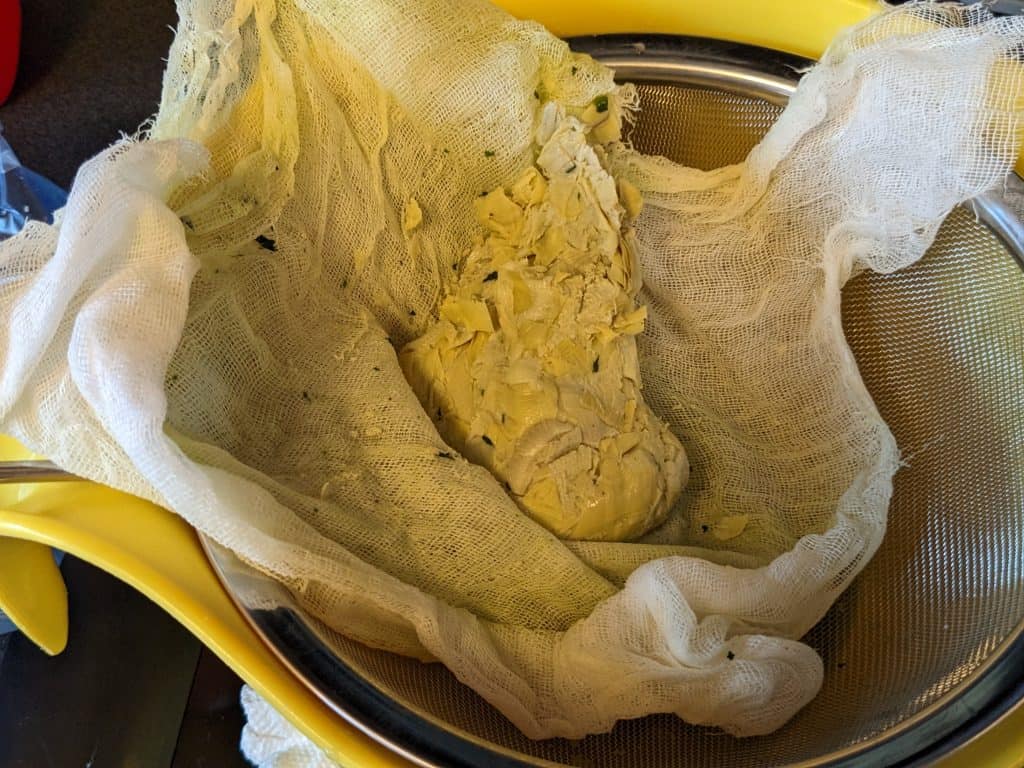 Chopped Artichoke Hearts in cheesecloth already strained