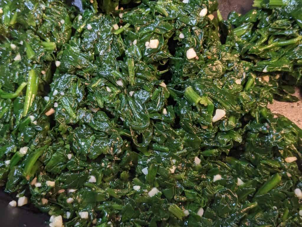 Cooked spinach and garlic - combined in pan