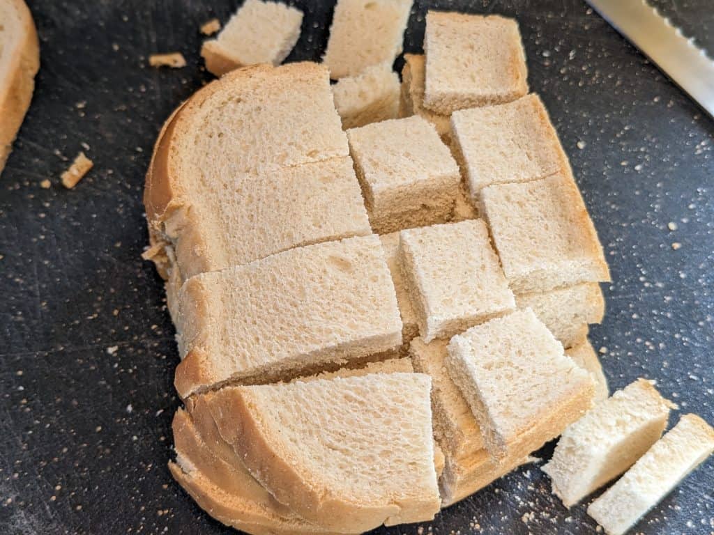 Keto bread slices in the process of being cubed