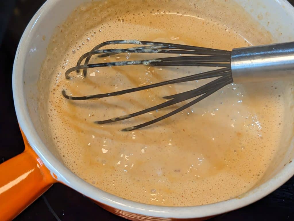 Heavy cream and chipotles getting thick in saucepan