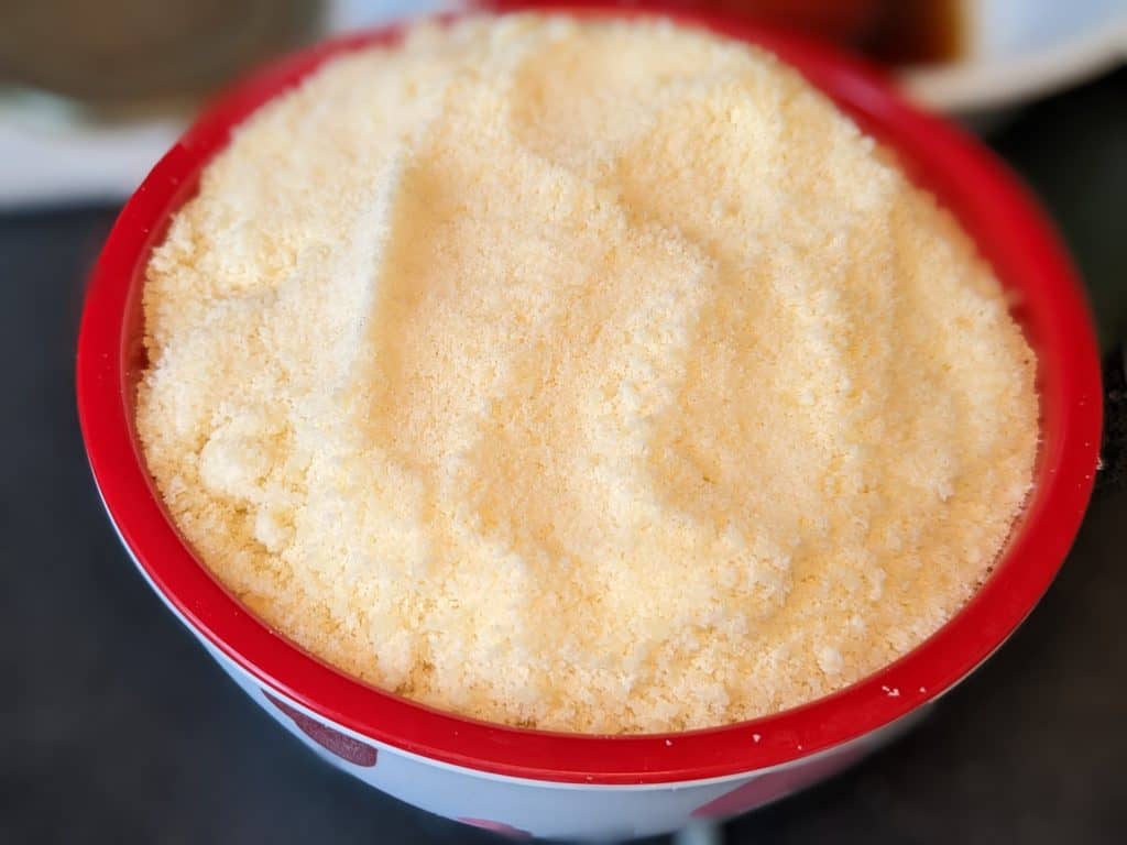 Bowl of grated parmesan cheese