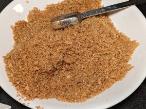 Seasoned keto bread crumbs in a shallow bowl