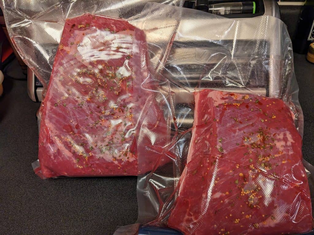 Two corned beef roasts vacuum sealed and prepared for sous vide cooking