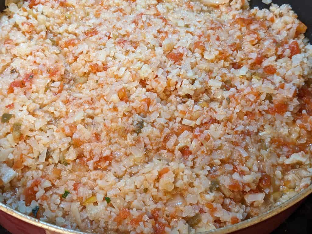 Cauliflower rice and salsa in pan