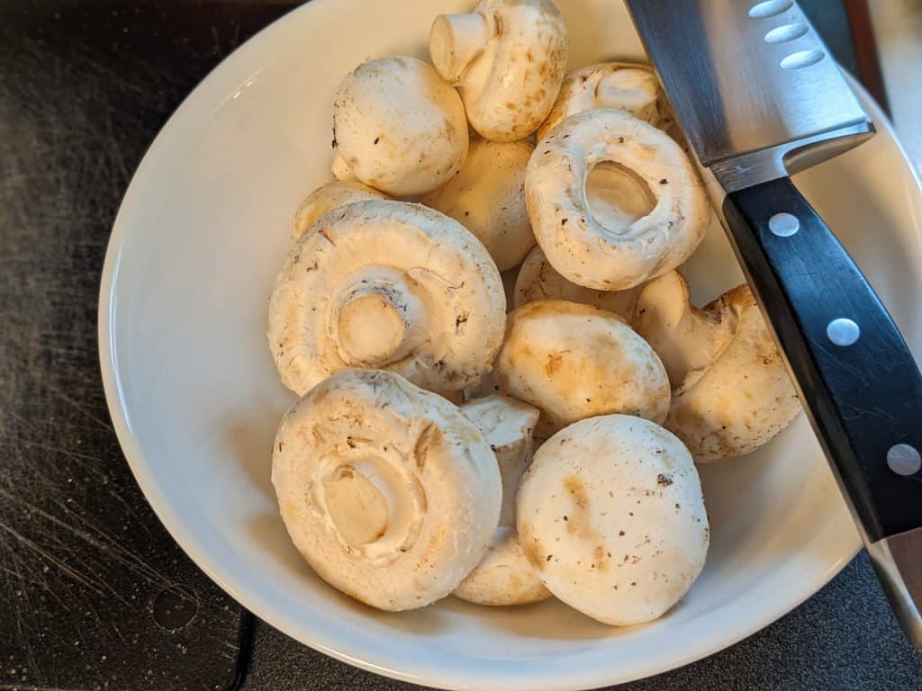 Whole raw white button mushrooms