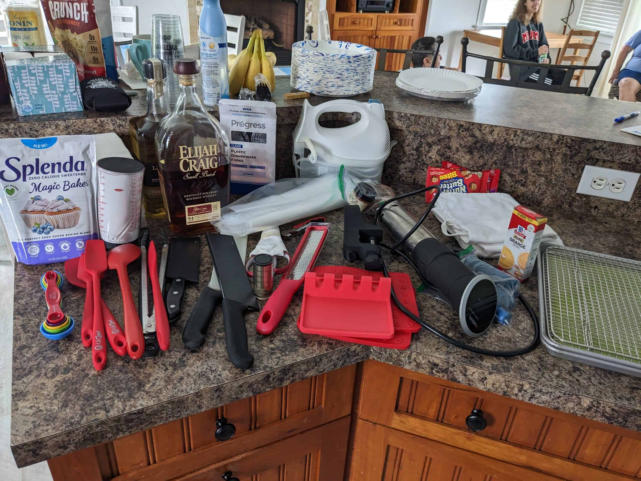 Kitchen Essentials for a vacation rental house arrayed on a countertop