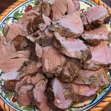 Herb-Rubbed Pork Tenderloin - sliced on serving plate