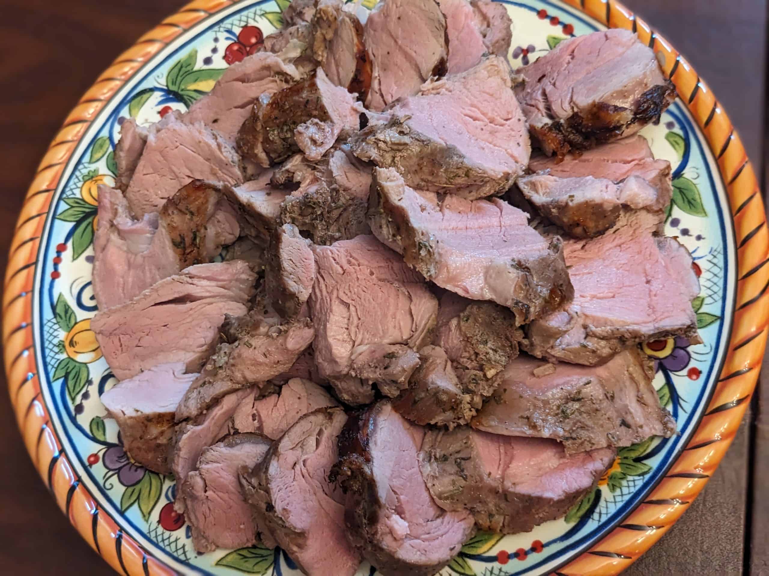 Herb-Rubbed Pork Tenderloin - sliced on serving plate