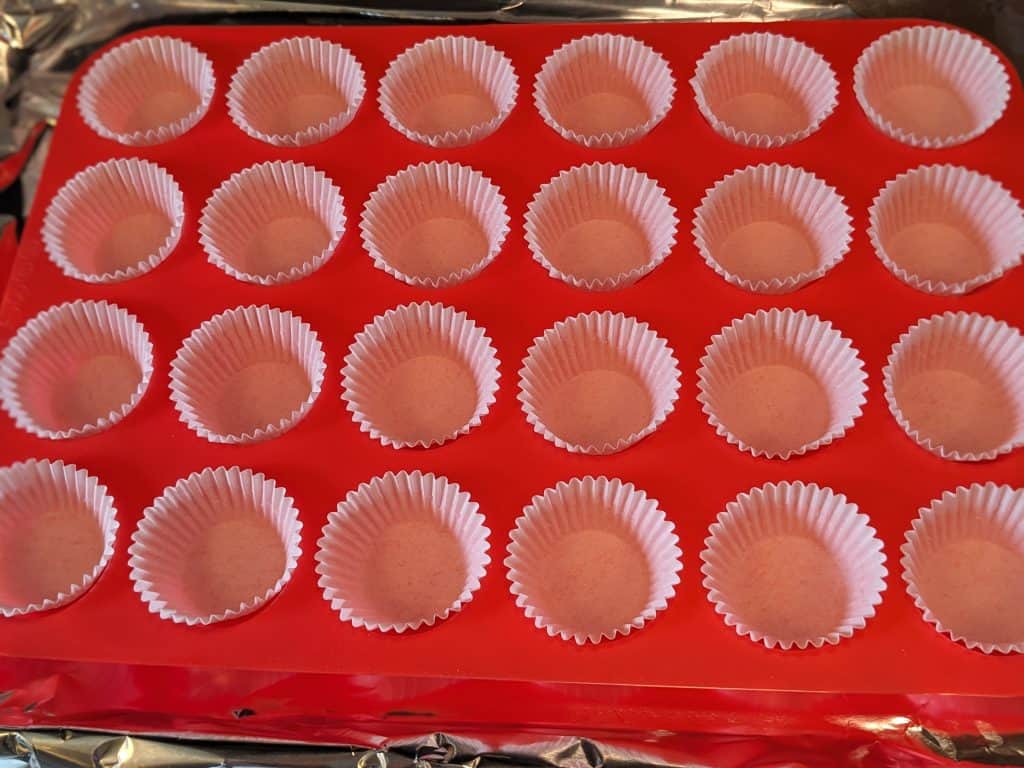 Mini Silicone Muffin Pan filled with parchment paper liners