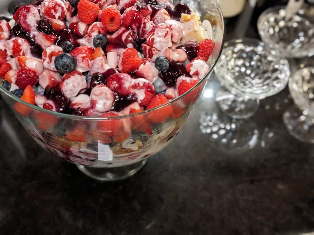 Keto Berry Trifle in Trifle Dish next to glass serving dishes
