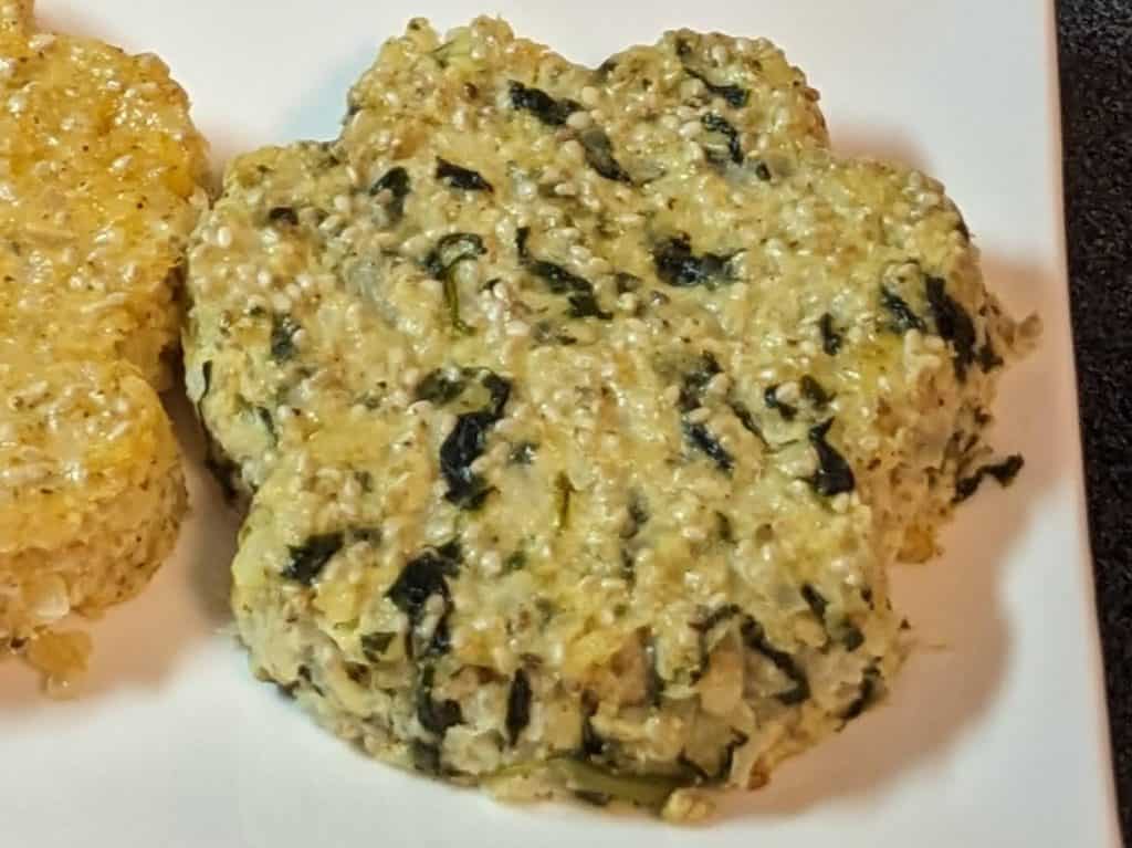 3 Cheese and Spinach Cauliflower Chia Cake in the shape of a paw print