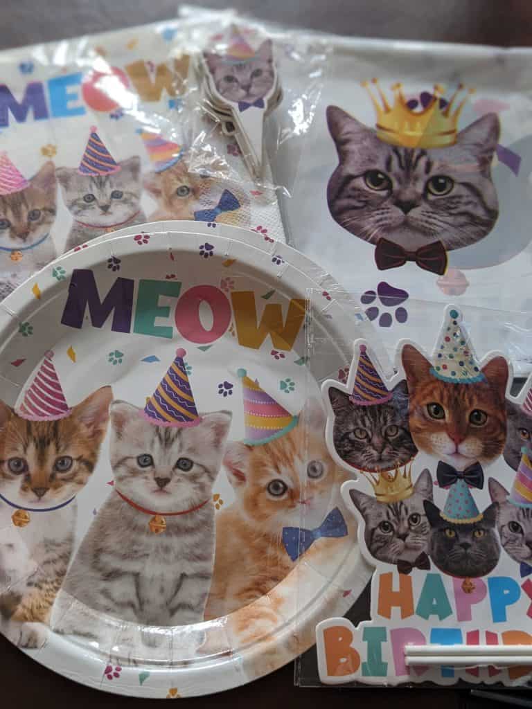 Cat birthday party plates, napkins, tablecloth, cake topper, and cupcake toppers