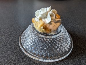 Single Keto Salmon Loaf Bite topped with Buttermilk Dill Whipped Cream