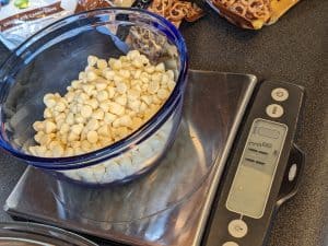 Sugar free white chocolate baking chips in microwave safe bowl