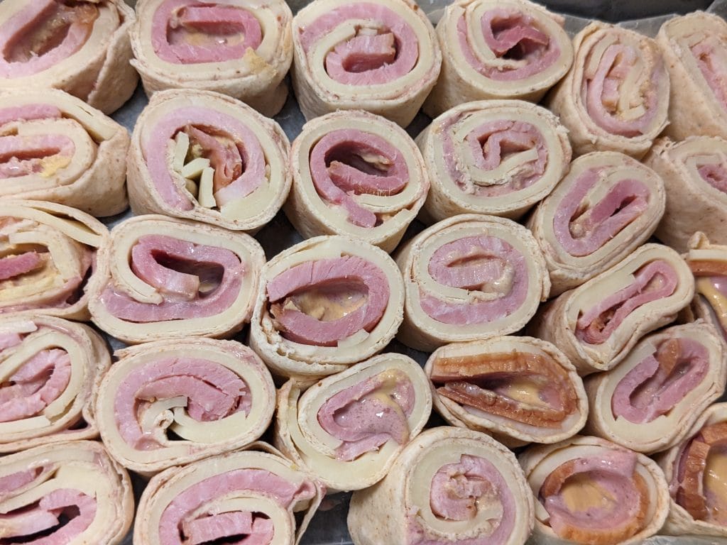Jammy Ham and Cheese Low Carb Roll-ups, sliced and in container