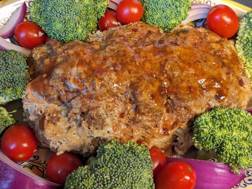 Bacon Cheddar Meatloaf - finished on a platter with veggies