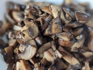 Sliced and cooked Baby Bella mushrooms