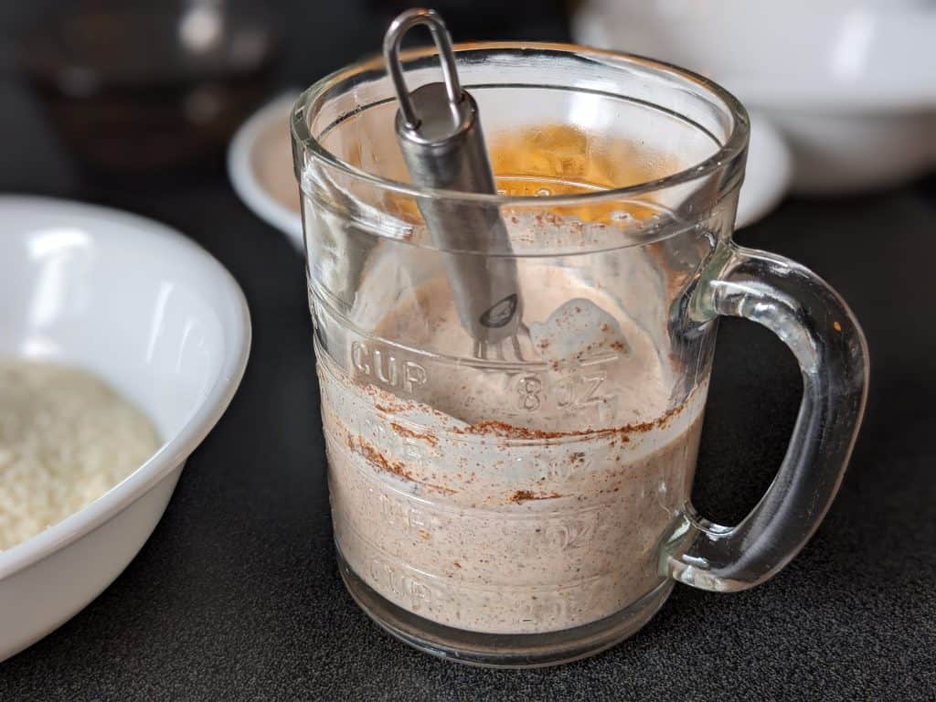 Heavy Cream and spices whisked together in a measuring cup