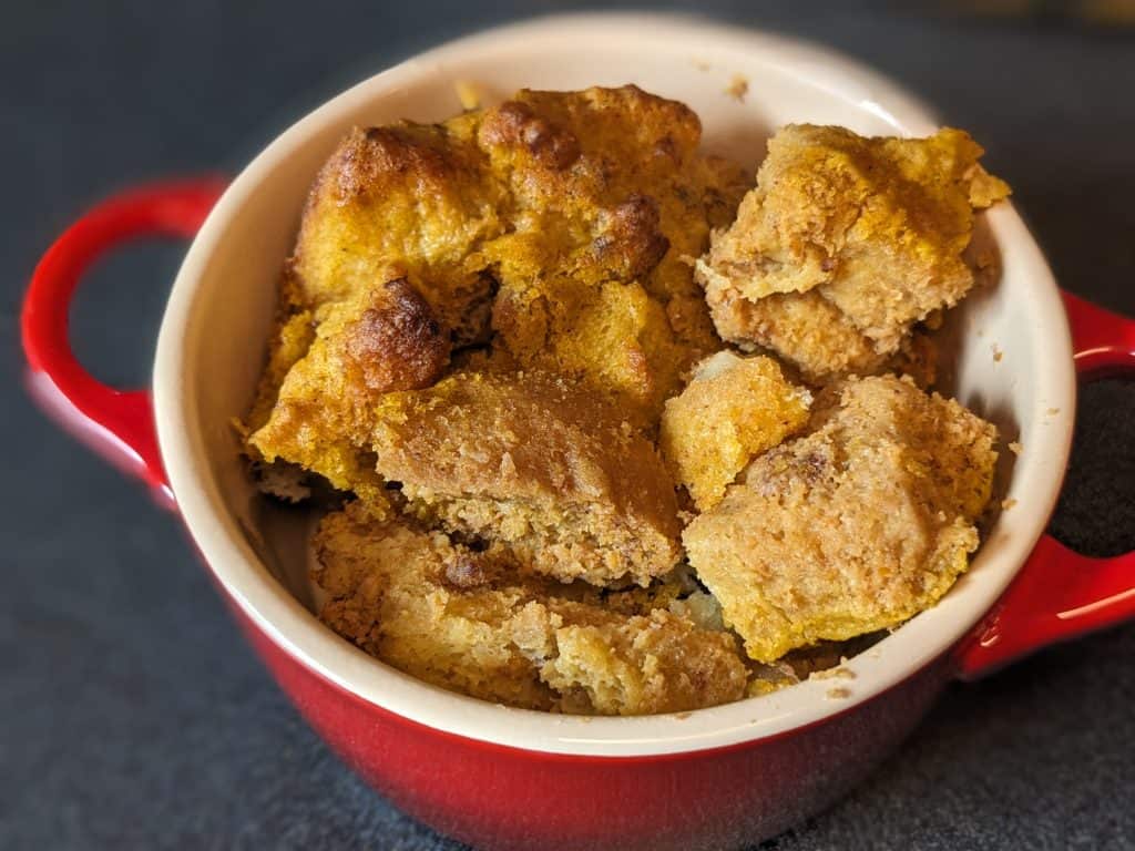 Low Carb Pumpkin Bread Pudding without any glaze in a red croquette