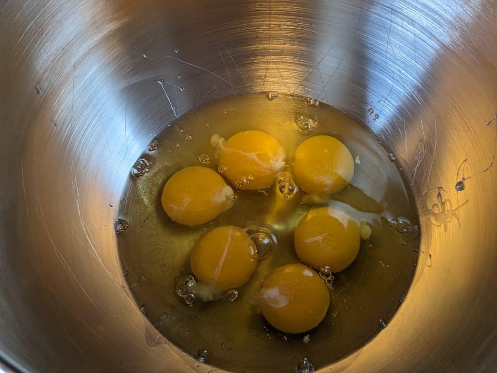 Raw eggs in a bowl