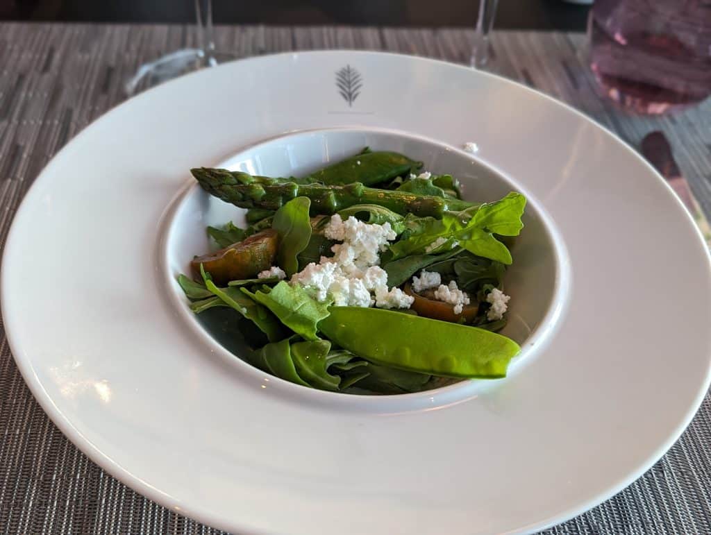 Broiled Feta Salad with Arugula, Asparagus, Fresh Peas, Minted Pesto