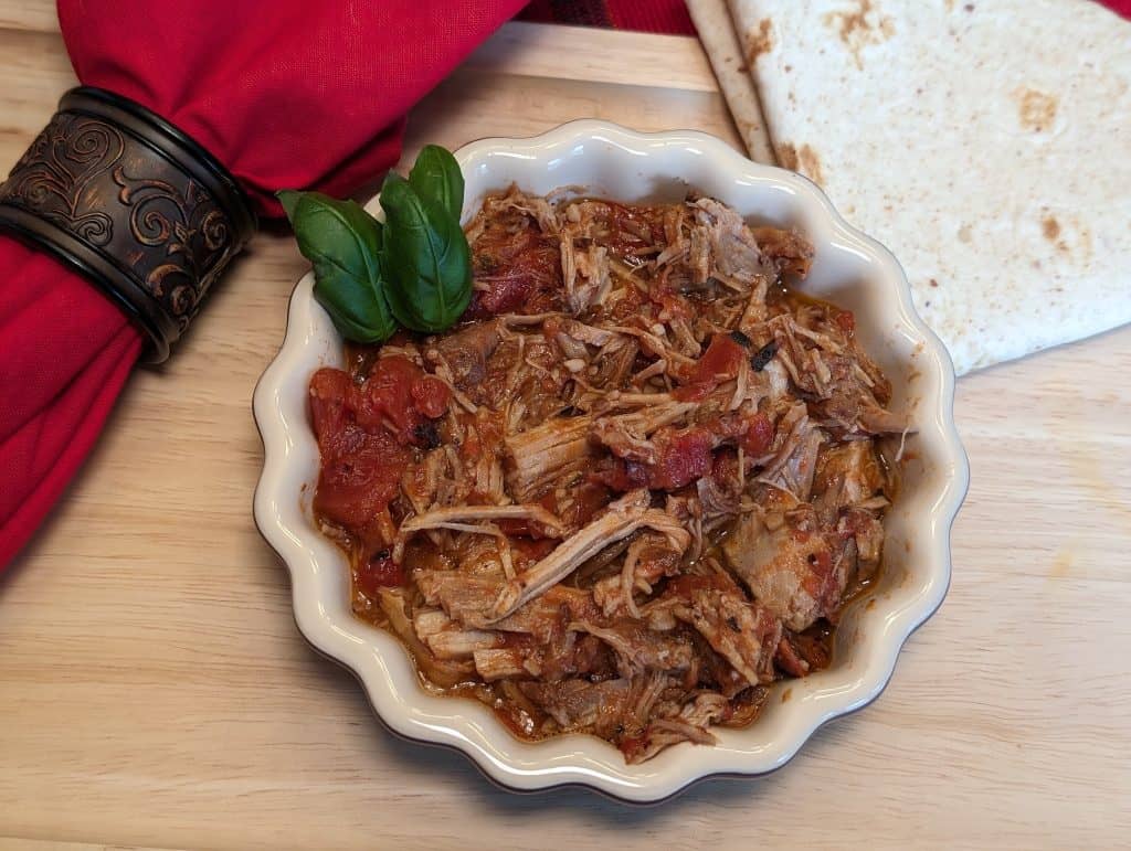 Braised Pork All'Arrabbiata in a dish with a low carb tortilla