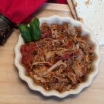 Braised Pork All'Arrabbiata in a dish with a low carb tortilla