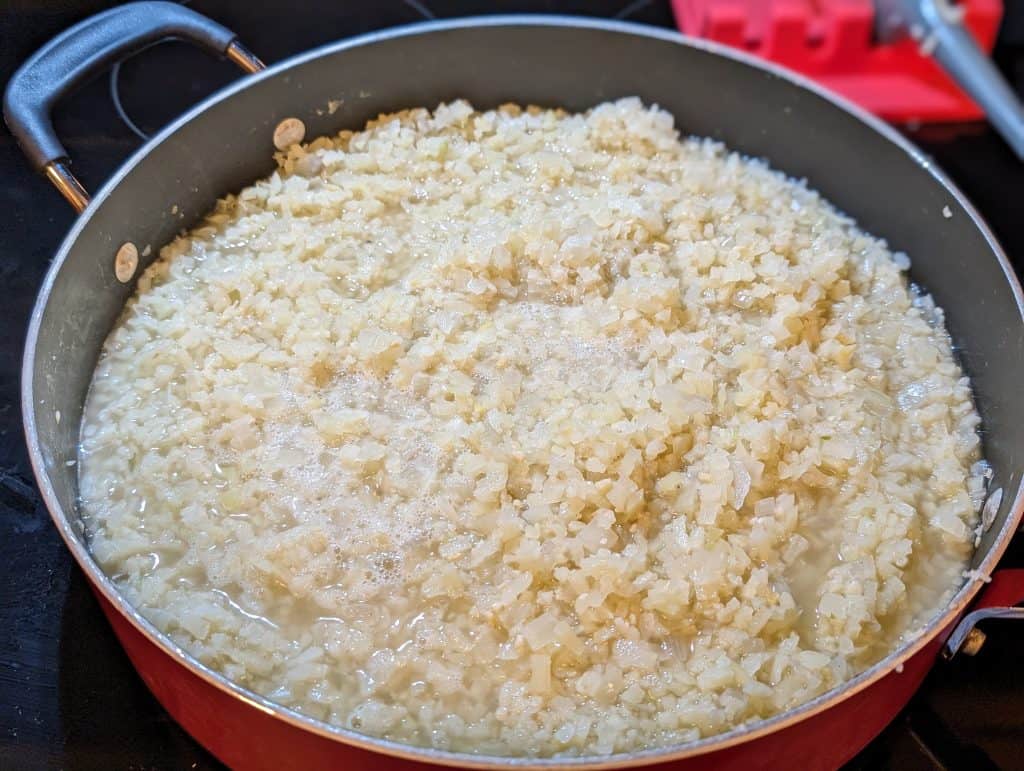 Cream Cauliflower Rice Risotto cooking in a pan