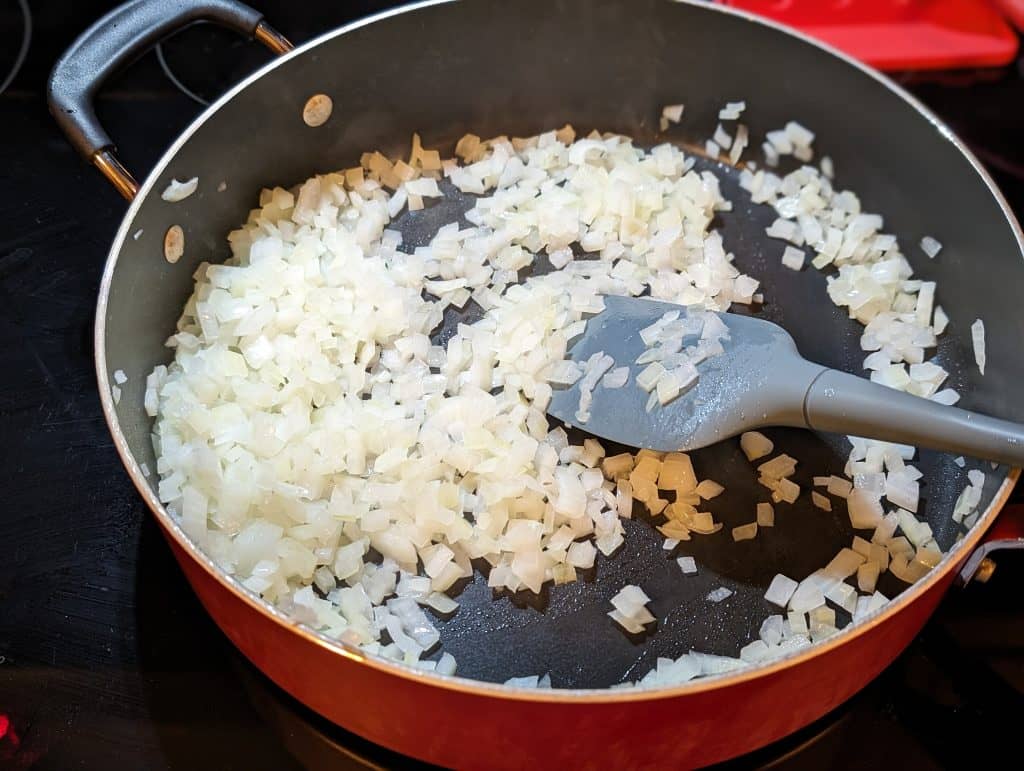 Chopped onions cooking in a pan