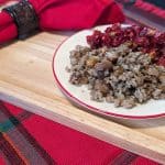 Greek Stuffing on a plate alongside Cranberry Pomegranate Relish