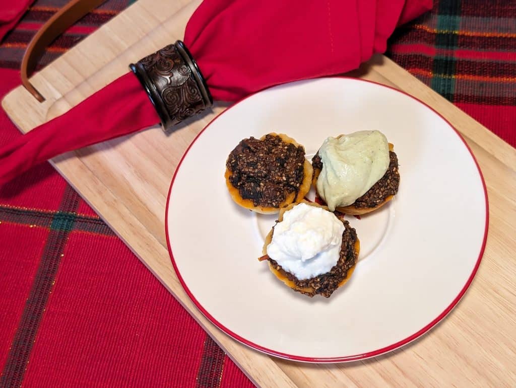 Harissa Lamb Tartlets 3 ways -- plain, with ricotta parmesan topping, and with an herbed cashew sauce