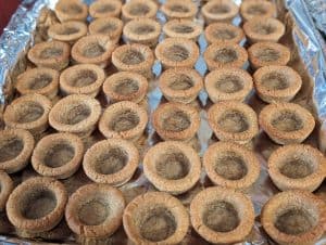 Baked cookie cups on a sheet pan