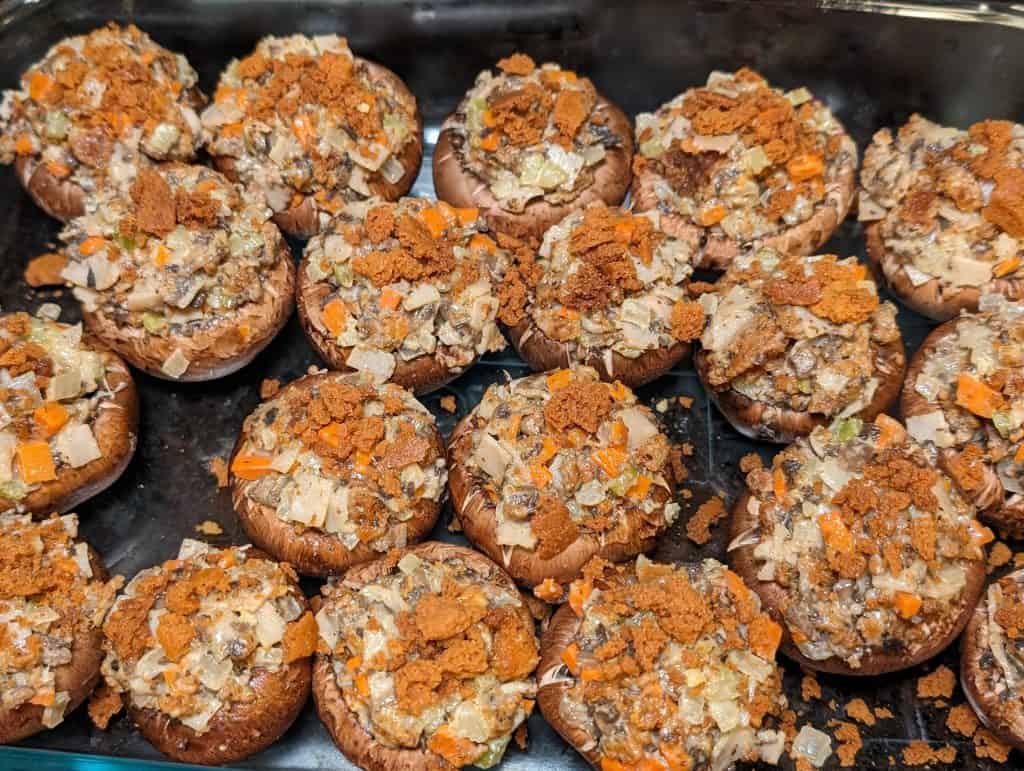 Unbaked Keto Turkey and Dressing Stuffed Mushrooms in a dish