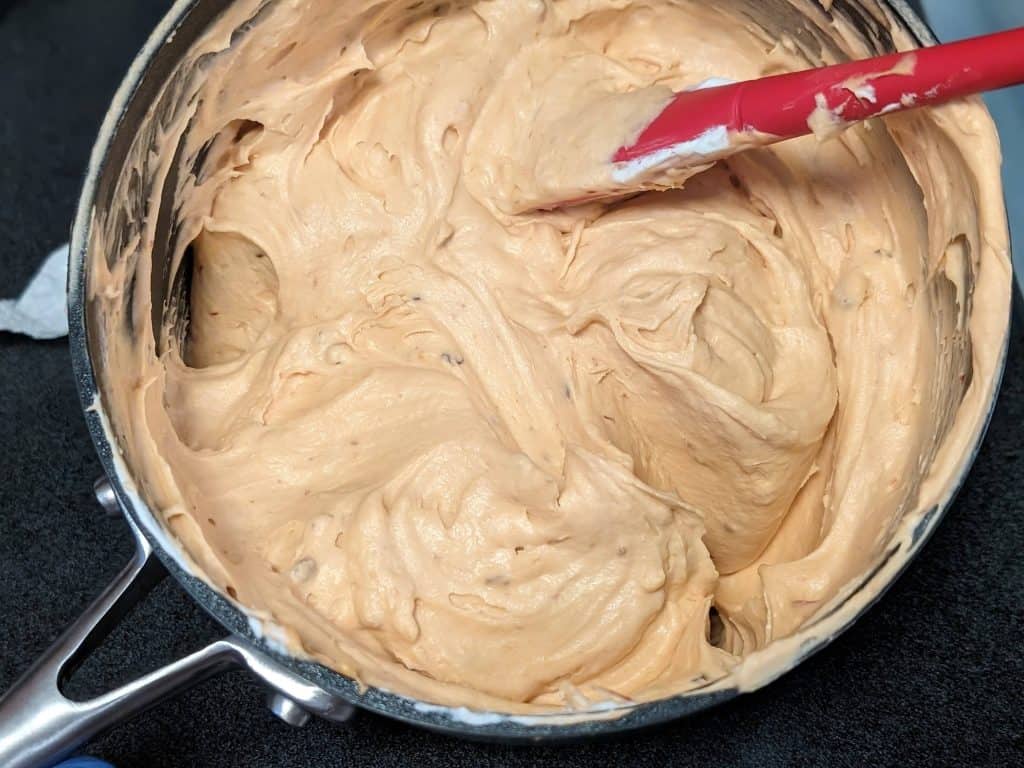 Mixing the chipotle sweet cream base and whipped cream to make Chipotle Keto Ice Cream