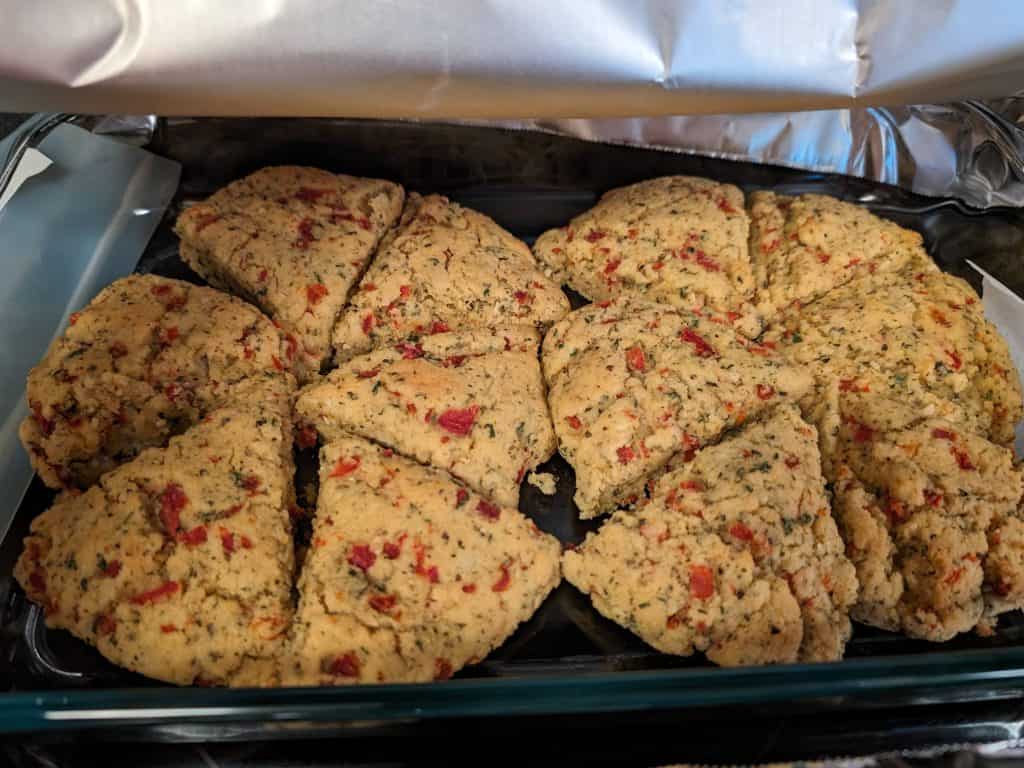 Baked Garlic and Roasted Red Pepper Scones - both with dairy and dairy free versions in a casserole dish for keeping warm