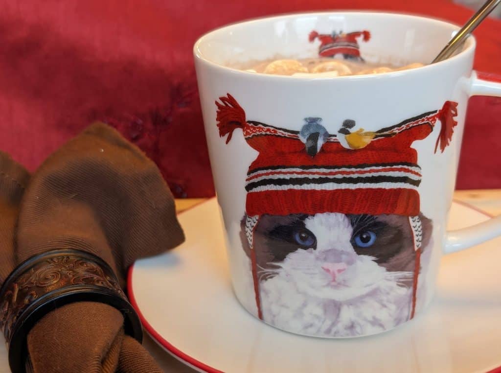 Cat mug filled with keto hot chocolate and marshmallows for the Keeping Warm Dinner Party - close-up