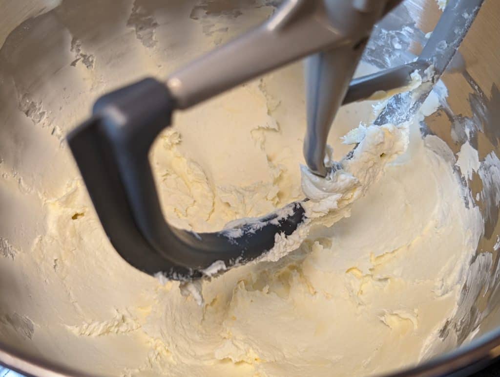 Cream cheese and butter beaten in a mixing bowl