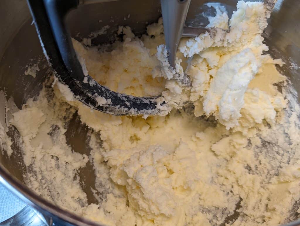 Cream cheese, butter, and sweetener mixture in mixing bowl