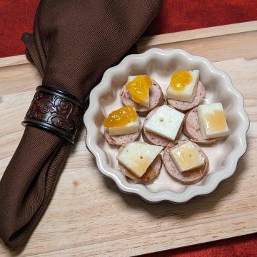 Sausage and Manchego Bites Plated showing 3 versions: no topping, topped with keto honey, topped with sugar free apricot preserves