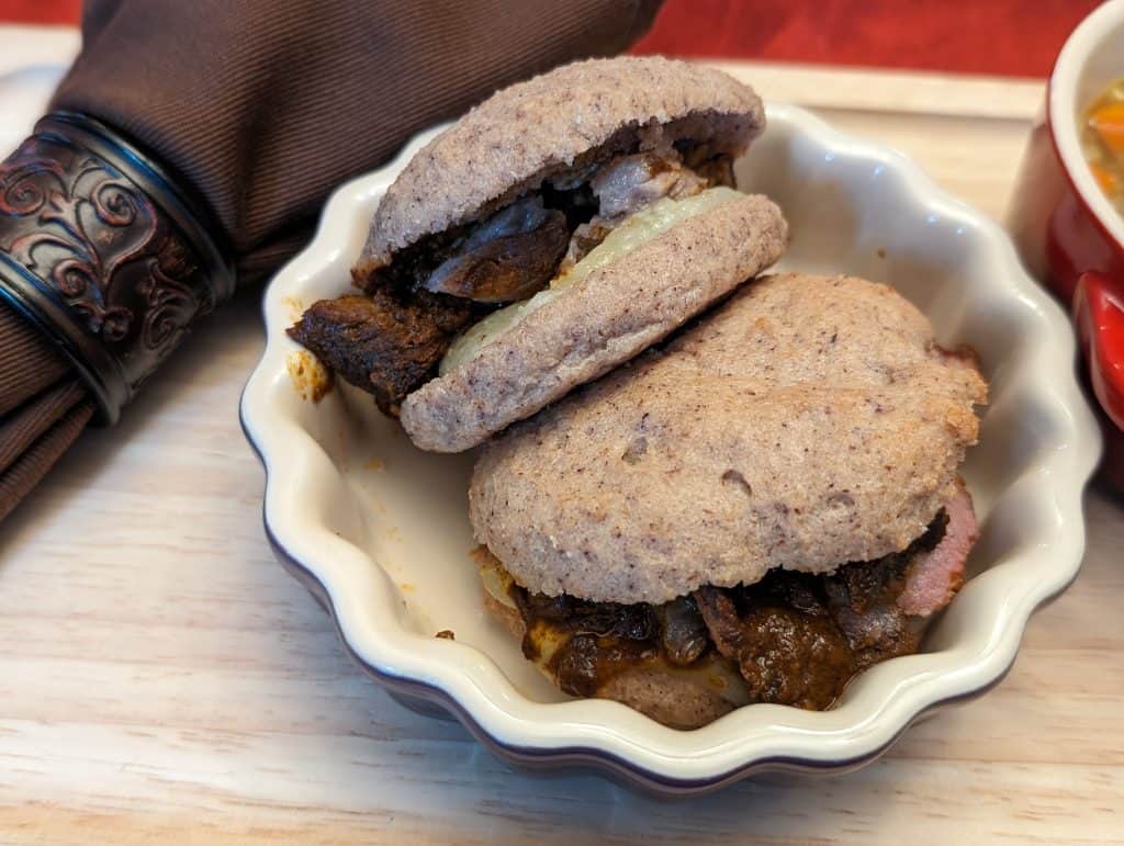 Savory Spiced Beef Roast in sliders made with Keto Flatbread, Manchego cheese, and mustard - plated close-up