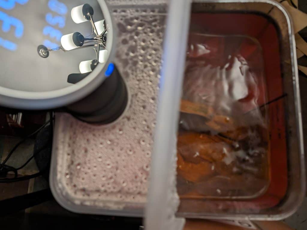 Savory Spice Beef Roast in a hot water bath being cooked sous vide