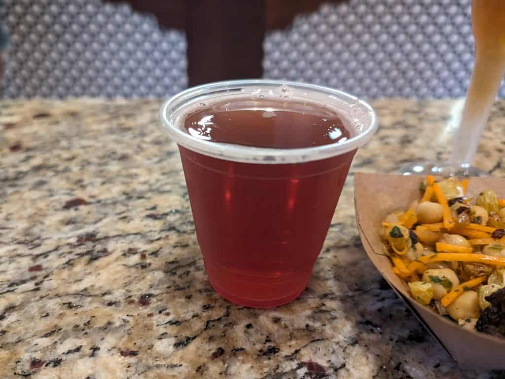 Blueberry Lavender Hard Cider in a small plastic cup