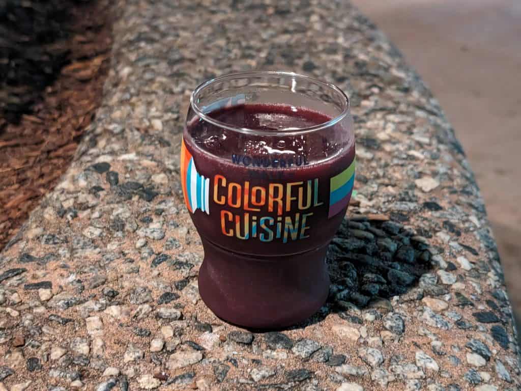 Wildberry Smoothie in a decorative plastic glass that says "Wonderful Walk of Colorful Cuisine"