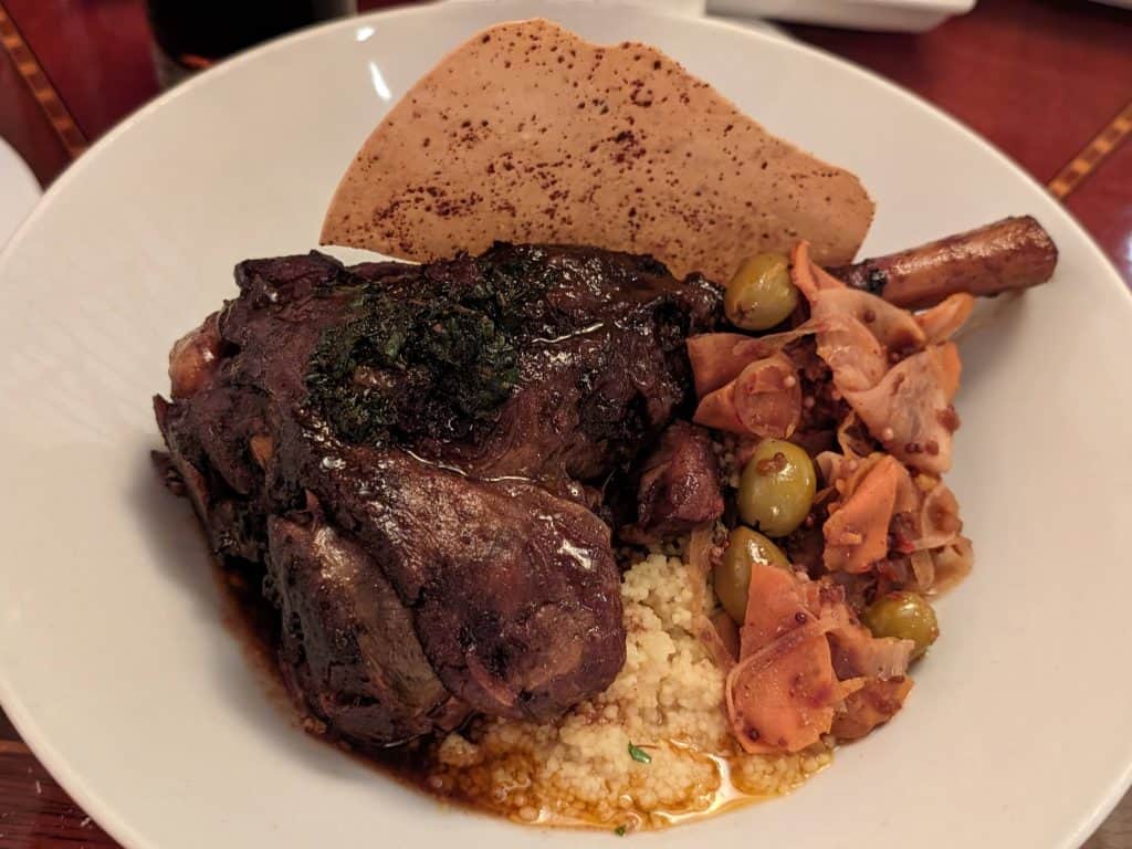 Braised Lamb Shank with Harissa Pickled Vegetables and Couscous